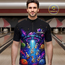 Load image into Gallery viewer, Man wearing a black t-shirt with a colorful alien abduction design in a bowling alley.