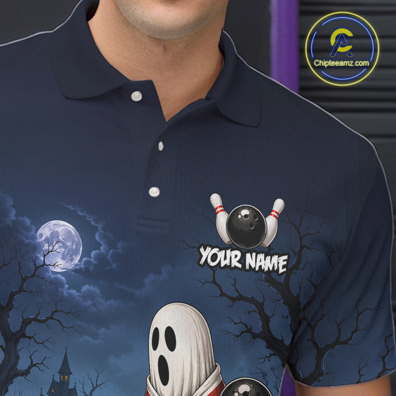 A close-up of a person wearing a navy blue polo shirt with a Halloween-themed graphic print featuring a full moon, bare trees, a ghost, bowling pins, and the text 'YOUR NAME'. 
