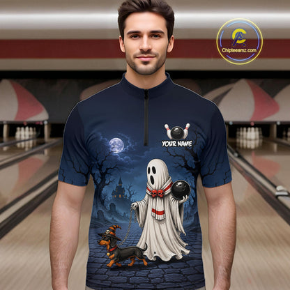 A man wearing a dark navy blue short-sleeve zip-up shirt with a Halloween-themed graphic print featuring a ghost dog and a dachshund on bowling lanes at night. 