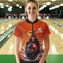 Load image into Gallery viewer, Female model wearing a custom orange grim reaper bowling quarter-zip shirt front view featuring a hooded grim reaper, glowing bowling ball, fiery smoke effect and sunset background at the bowling alley