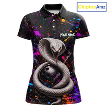 Load image into Gallery viewer, Polo shirt with snake design and colorful splashes on a black background, branded 'ChipteeAmz'.