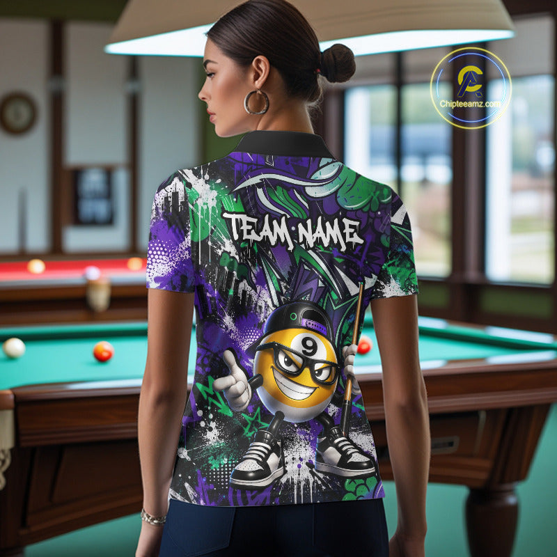 Person wearing a colorful polo shirt with a billiard ball design in a pool hall.