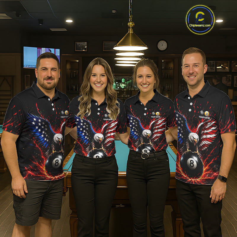 Four people wearing matching biliiard shirts with a design of an eagle, American flag, and 8 ball in a bar setting.