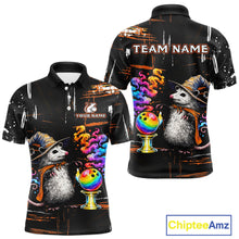 Load image into Gallery viewer, Front and back views of a black short-sleeve polo shirt featuring a colorful printed design of opossum wearing hats, bowling balls, and smoke, with customizable text placeholders 'TEAM NAME' and 'YOUR NAME'.