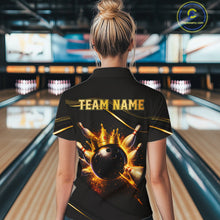 Load image into Gallery viewer, A woman viewed from behind wearing a black bowling-themed shirt with a large graphic of a bowling ball and pins and the text 'TEAM NAME' on the back, standing in a bowling alley.
