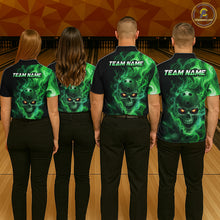 Load image into Gallery viewer, Four people wearing matching green and black shirts with a skull design on a bowling alley.