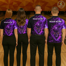 Load image into Gallery viewer, Four people wearing purple shirts with a skull design on a bowling alley.
