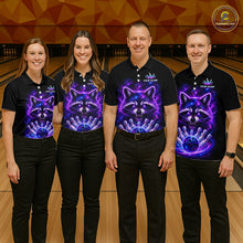 Load image into Gallery viewer, Four people standing in a bowling alley wearing matching black polo shirts with a vibrant purple and blue cosmic raccoon graphic on the front. The shirts also feature a small white logo on the left chest and a crown graphic on the right chest.
