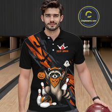 Load image into Gallery viewer, Man wearing a black Halloween bowling polo featuring a raccoon wearing an orange bandana, ghost and pumpkin accents, bowling pins and ball, with personalized name and team name text.