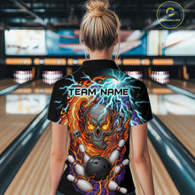 Load image into Gallery viewer, Woman wearing a black bowling quarter zip featuring a flaming skull graphic, lightning effects, bowling pins, and a black bowling ball, with custom team name text.