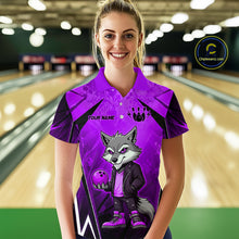 Load image into Gallery viewer, Woman wearing a purple and black bowling polo shirt featuring a gray wolf mascot holding a purple bowling ball, with custom player name text.