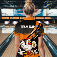 Load image into Gallery viewer, Woman wearing a orange and black bowling quarter zip featuring a chicken holding a beer mug, red bowling ball, scattered pins, and custom team name text.