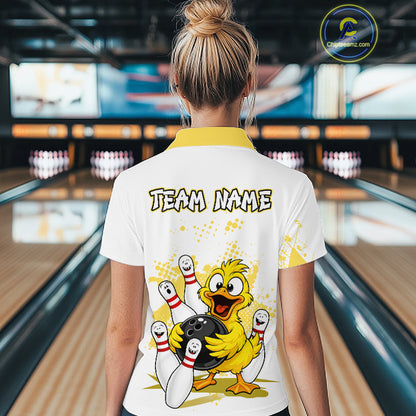 A woman viewed from behind wearing a white bowling-themed t-shirt with a yellow collar and a large cartoon duck graphic on the back. The shirt features the text 'TEAM NAME' and a bowling pin design.
