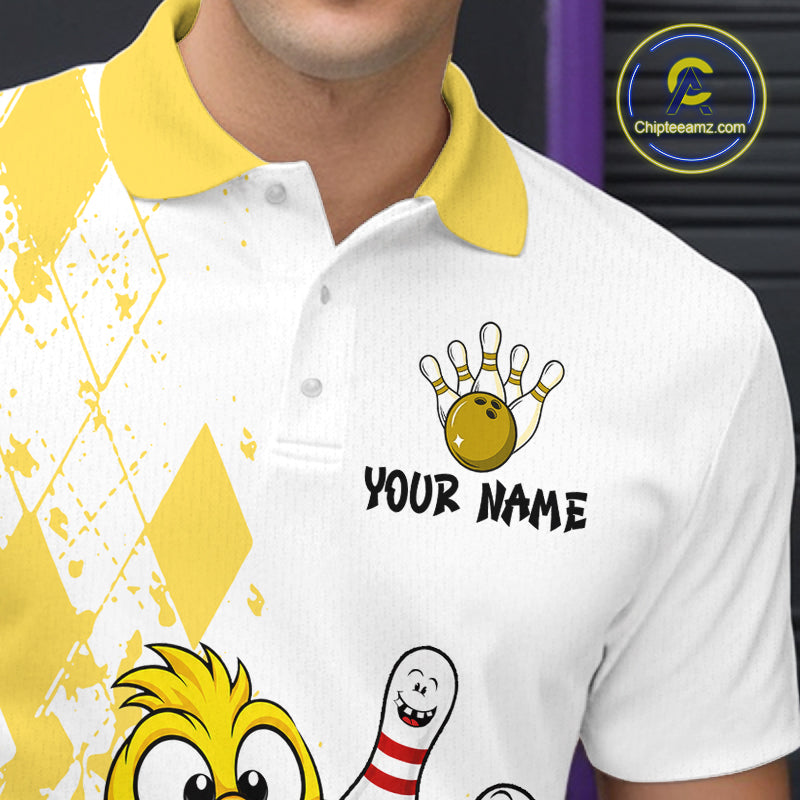 A close-up of a person wearing a white and yellow custom bowling-themed polo shirt. The shirt features a yellow collar, a yellow and white diamond pattern on the right side, and cartoon bowling graphics including a bowling pin, bowling ball, and a bowling pin character.