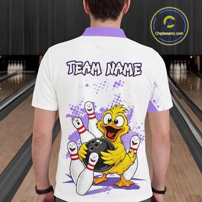 A man viewed from behind wearing a white short-sleeve bowling t-shirt with a purple collar, featuring a cartoon yellow duck holding bowling pins and a bowling ball, with the text 'TEAM NAME' printed on the back. The background shows a bowling alley with lanes and pins.
