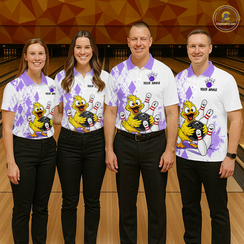 Four people standing together in a bowling alley wearing matching white bowling shirts with purple diamond patterns and a large cartoon bowling character graphic on the front. The shirts also have 'YOUR NAME' printed on the chest.