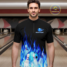 Load image into Gallery viewer, Man wearing a black bowling shirt with blue flame design in a bowling alley.