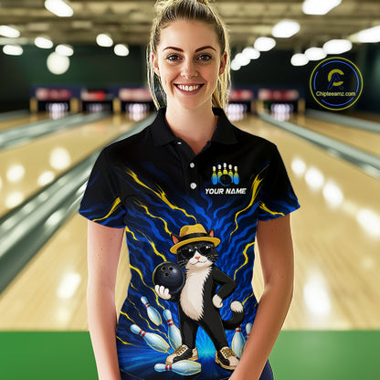 A woman stands in a bowling alley wearing a black short-sleeve polo shirt with a colorful graphic print of a cat bowling, blue lightning effects, bowling pins, and the text 'YOUR NAME' on the chest. A circular 'Chileanlic.