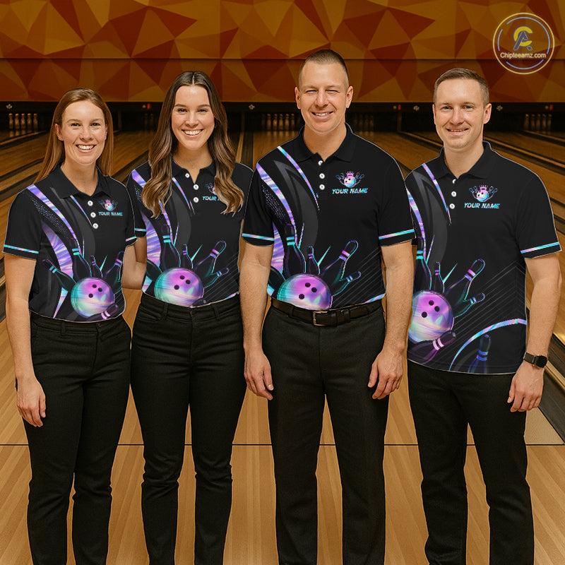 Four people wearing matching bowling shirts on a bowling alley.