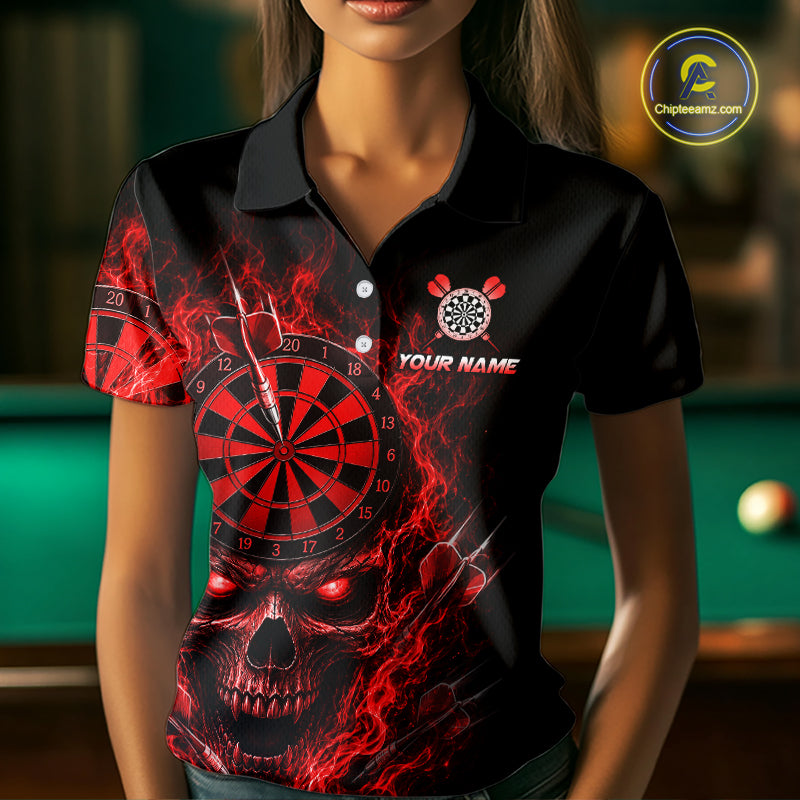 A woman wearing a black short-sleeve polo shirt with a dramatic red and black dartboard-themed graphic featuring a skull and dartboard design. The shirt has a custom name placeholder and a dartboard logo on the chest.