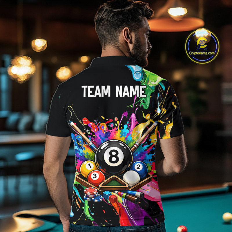Person wearing a black t-shirt with colorful pool design and 'TEAM NAME' text, standing in a pool hall.