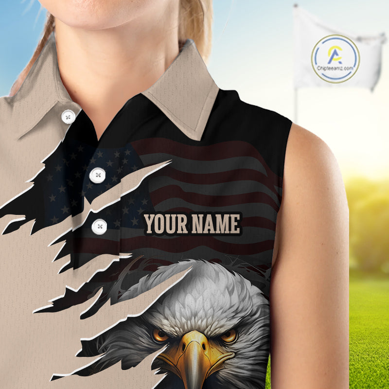 Women wearing a Personalized Eagle Golf Sleeveless Polo Shirt featuring a fierce bald eagle holding a golf ball, distressed American flag design, custom name and team name, beige and black performance golf jersey for women.