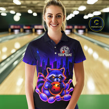 Load image into Gallery viewer, Women wearing bowling polo shirt featuring a raccoon holding a bowling ball framed by pins with purple city skyline background.