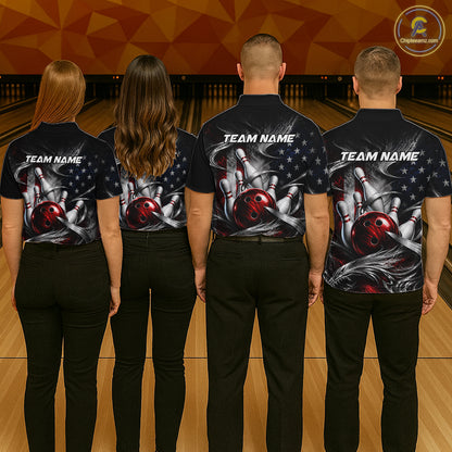 Four people standing from the back in a bowling alley, wearing matching black short-sleeve shirts with a large bowling-themed graphic on the back. The graphic features bowling pins, bowling balls, stars, and the text 'TEAM NAME'.