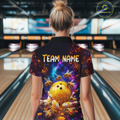Woman wearing of a dark bowling polo with cosmic honeycomb graphics, bees, honey-dripping bowling balls, pins, and custom team name text.