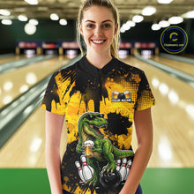 Load image into Gallery viewer, Women wearing bowling quarter zip shirt featuring a dinosaur holding beer with bowling pins and ball artwork on black yellow background.