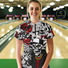 Load image into Gallery viewer, Person wearing a colorful bowling shirt with a skull design in a bowling alley.