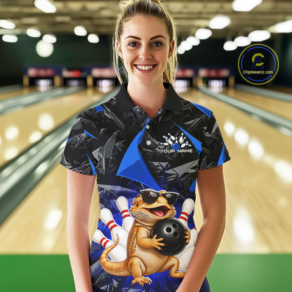 Women’s blue bearded dragon bowling polo shirt, front view on female model in bowling lane 