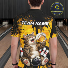 Load image into Gallery viewer, Person wearing a bowling-themed shirt with a cat design in a bowling alley.