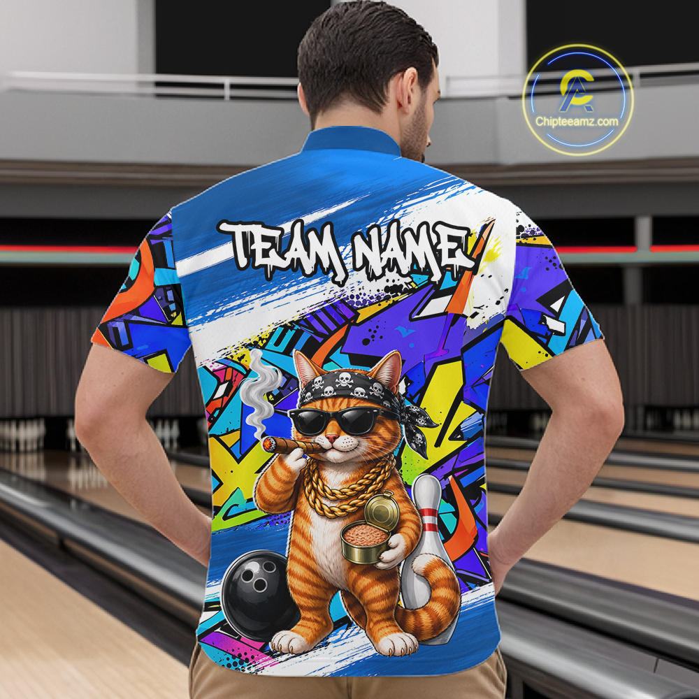 Man wearing a colorful shirt with a cat graphic and 'Team Name' text at a bowling alley.