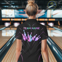 Load image into Gallery viewer, Person wearing a black bowling shirt with gold designs and 'TEAM NAME' text in a bowling alley.