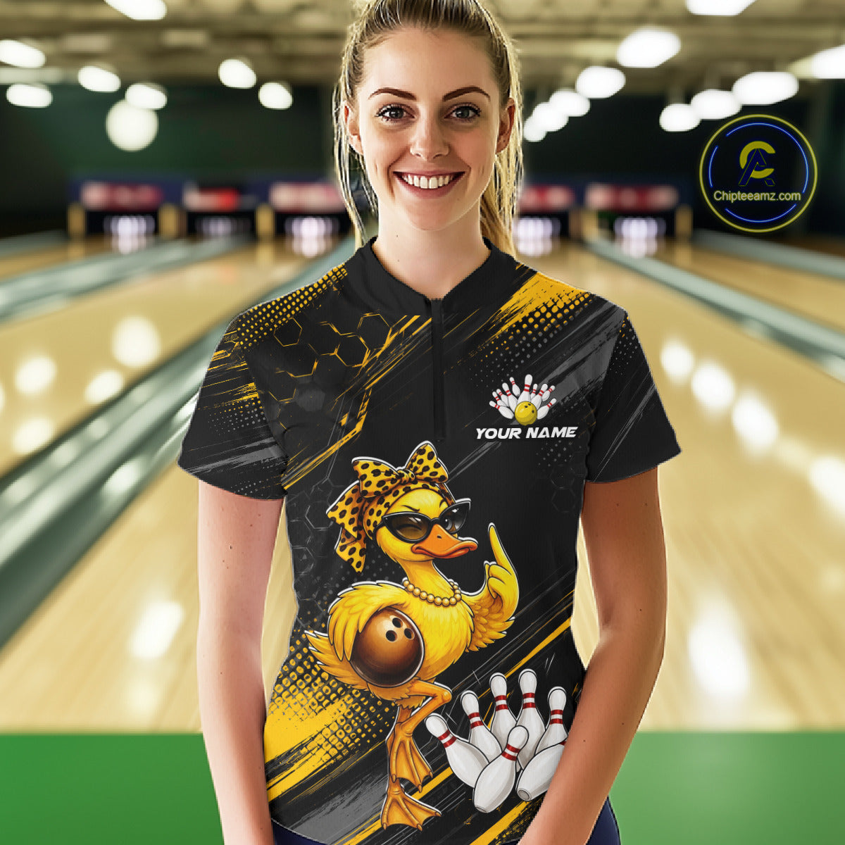 Woman wearing a custom bowling shirt with a duck design in a bowling alley.
