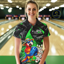 Load image into Gallery viewer, Woman wearing a colorful bowling shirt with a parrot design in a bowling alley.