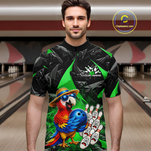 Load image into Gallery viewer, Man wearing a colorful bowling shirt with a parrot design in a bowling alley.