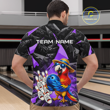 Load image into Gallery viewer, Man wearing a colorful bowling shirt with a parrot design in a bowling alley.