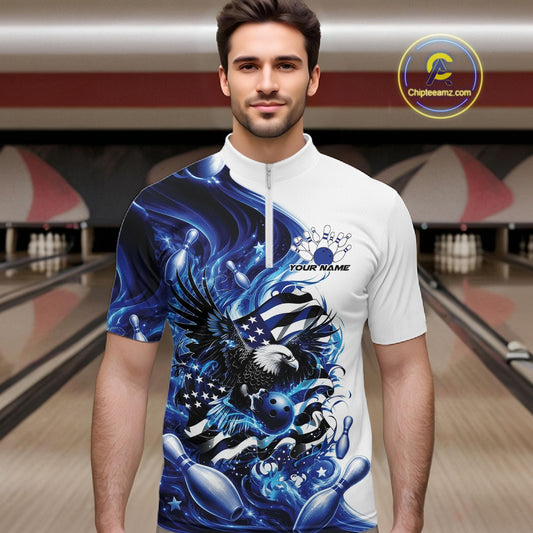 Front view male model in a bowling lane wearing a white and blue quarter zip shirt with eagle artwork, bowling elements, and flowing flag inspired graphics.