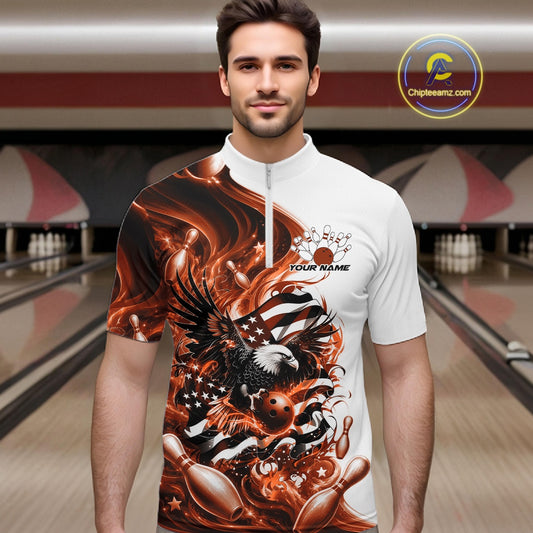 Front view of a male model in a bowling lane wearing a white and orange quarter zip shirt with eagle graphics and flowing flag inspired artwork.