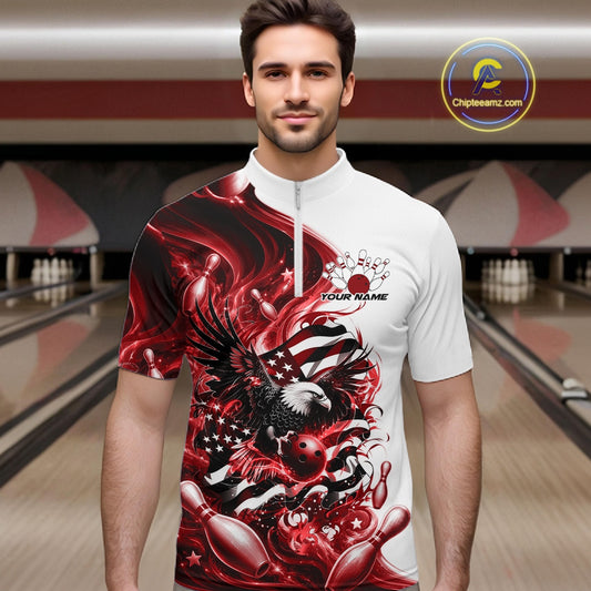 Front view male model in a bowling lane wearing a white and red quarter zip shirt with eagle graphics, bowling elements, and flowing flag inspired artwork.