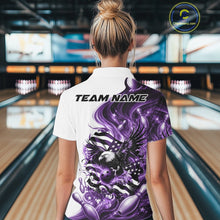 Load image into Gallery viewer, Female model back view in a bowling lane wearing a white and purple polo shirt with eagle artwork and flowing flag inspired graphics.