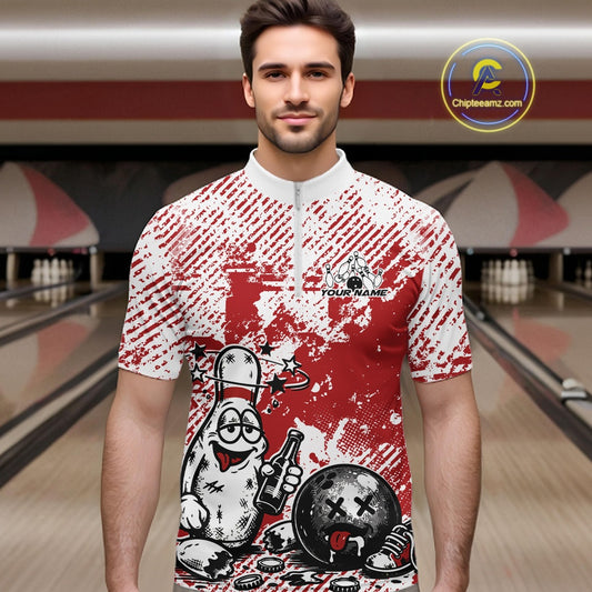 Male model in a bowling lane wearing a red and white quarter-zip shirt, playful drunk bowling pin artwork with beer bottle and bowling ball.