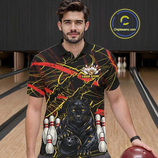 A man wearing a custom bowling-themed short-sleeve polo shirt with a black panther, bowling pins, and red and yellow graphic details, standing in a bowling alley. 