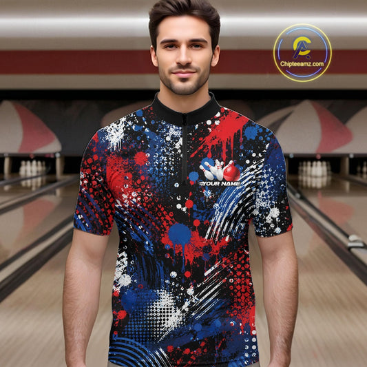 A male model in a red white and blue splatter patriotic bowling jersey at a bowling alley.
