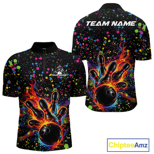 Front and back views of a black mens bowling quarter-zip shirt with a flaming bowling ball striking pins and colorful paint splatter graphics.