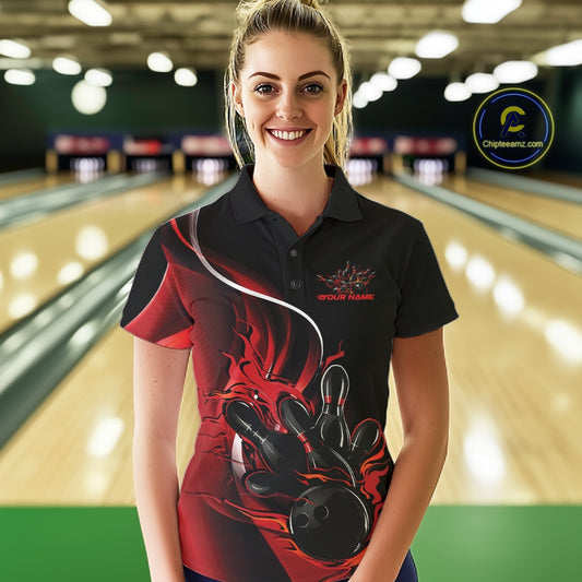 Female model front view in bowling lane wearing black and red polo shirt with flaming bowling ball hitting pins in intense athletic motion scene.