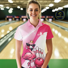 Load image into Gallery viewer, Female model at a bowling lane wearing a pink bowling polo shirt with a crowned flamingo in sunglasses and a bowling ball design.