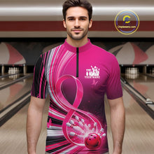 Load image into Gallery viewer, Male model wearing a pink bowling quarter zip with breast cancer awareness ribbons and bowling graphics, front view at the bowling lane